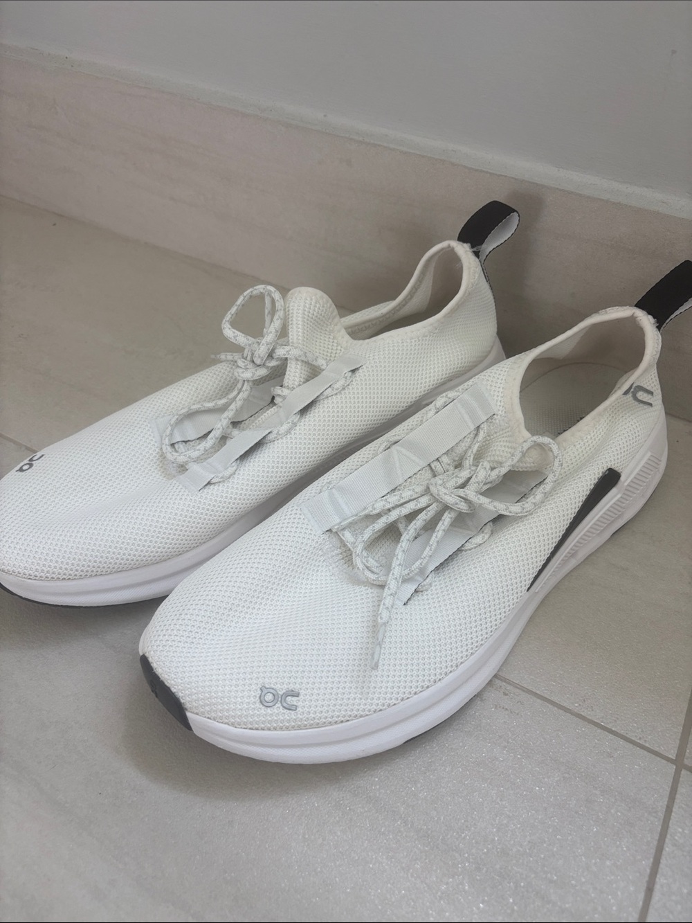 On Running Men's White Slip-On Lace Sneakers with Black Heel Tabs